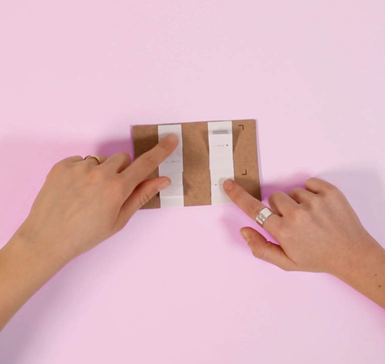 Two hands using an Interface made out of Paper