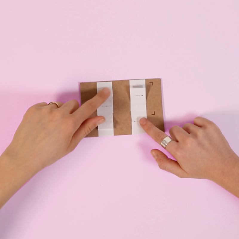 Two hands using an Interface made out of Paper